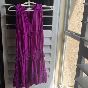She is a size small and from the brand ramybrook company! Eye catching purple!